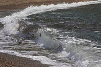 Welle am Strand von Korsika