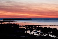 Felswatt Abendrot vor Kueste